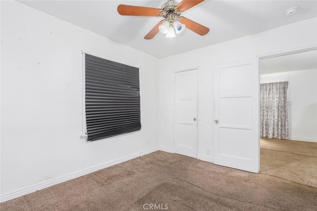 unfurnished bedroom with ceiling fan and carpet flooring