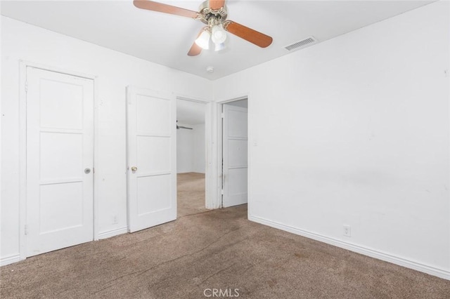 unfurnished bedroom with ceiling fan and carpet flooring