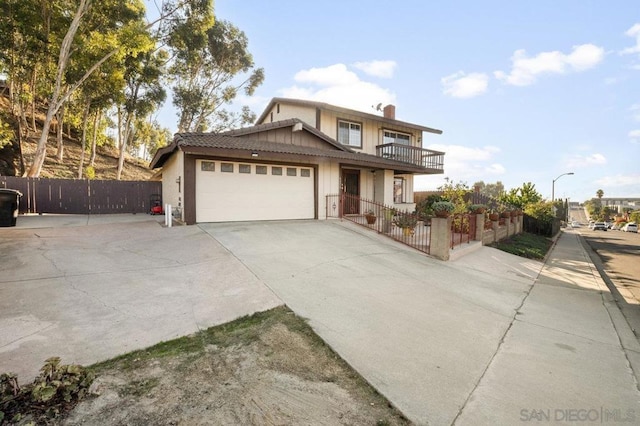 view of front of house with a balcony and a garage