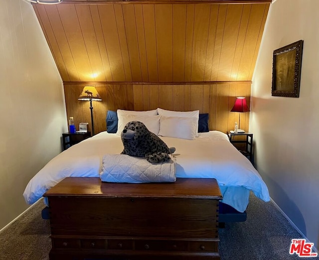 bedroom featuring carpet flooring, wooden walls, wooden ceiling, and lofted ceiling