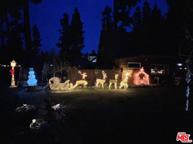 view of yard at twilight