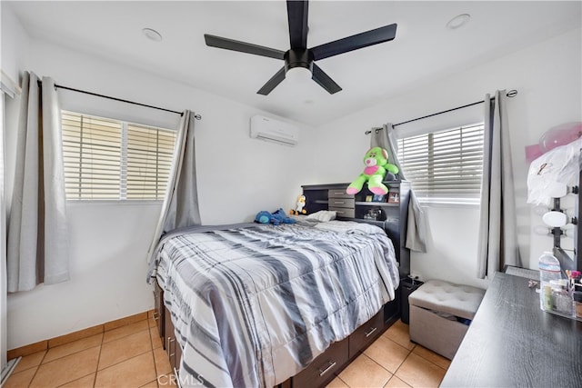 bedroom with ceiling fan, light tile patterned floors, and a wall mounted AC