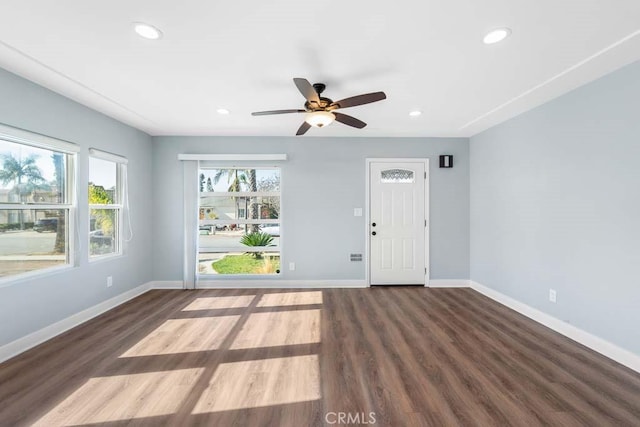 spare room with ceiling fan and dark hardwood / wood-style floors