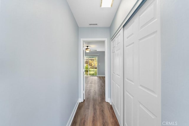 corridor featuring dark wood-type flooring