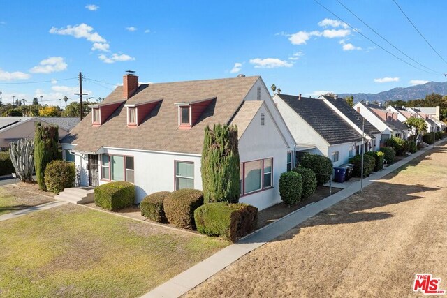 view of side of home featuring a lawn