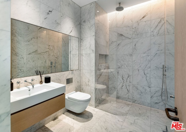 bathroom featuring vanity, a shower with door, toilet, and tile walls