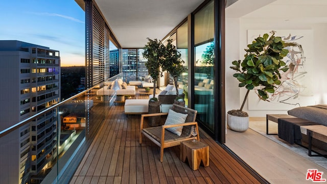 view of balcony at dusk