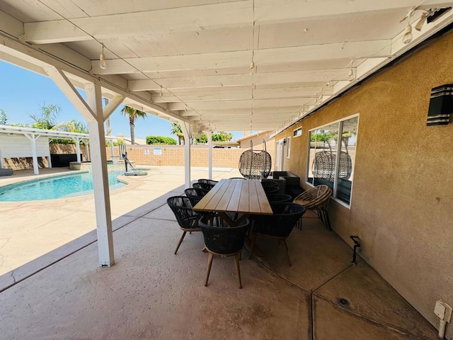 view of patio featuring a pergola and a fenced in pool