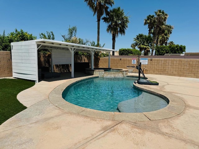 view of swimming pool featuring a patio and an in ground hot tub