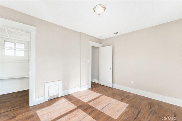 unfurnished bedroom featuring hardwood / wood-style floors