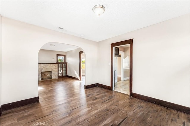 empty room featuring dark hardwood / wood-style flooring