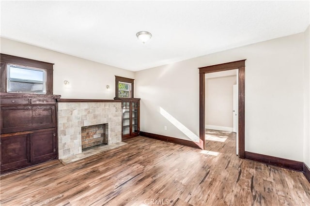 unfurnished living room featuring hardwood / wood-style flooring