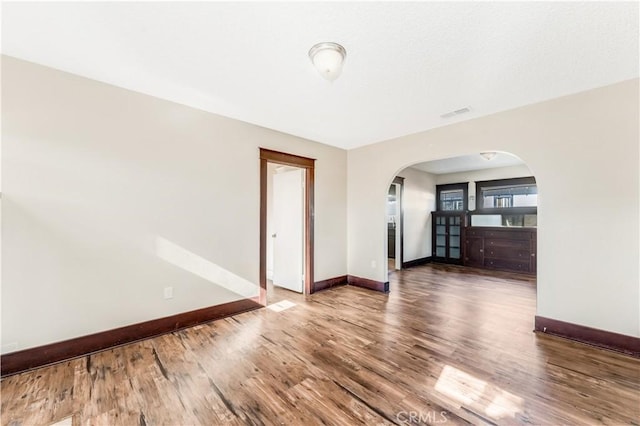 empty room featuring hardwood / wood-style floors