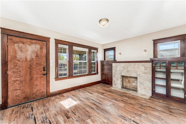 unfurnished living room with hardwood / wood-style flooring