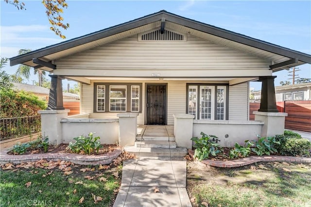 bungalow-style home featuring covered porch