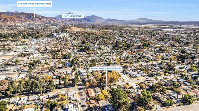 birds eye view of property with a mountain view