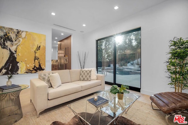 living room with light hardwood / wood-style flooring