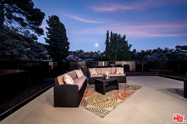 patio terrace at dusk with an outdoor living space