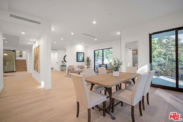 dining space featuring light wood-type flooring