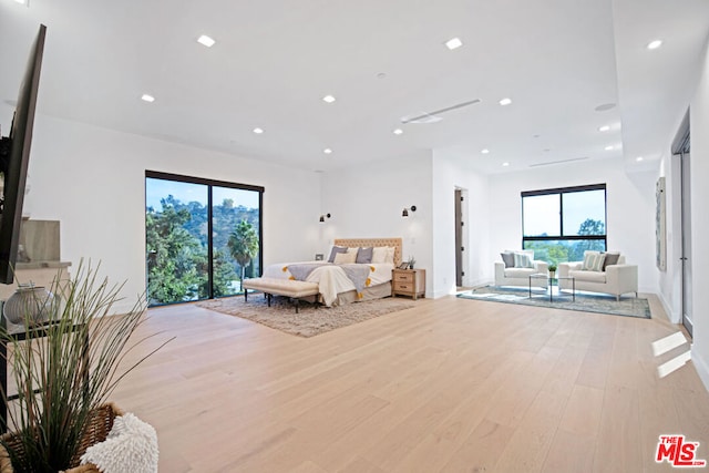 bedroom with light hardwood / wood-style floors