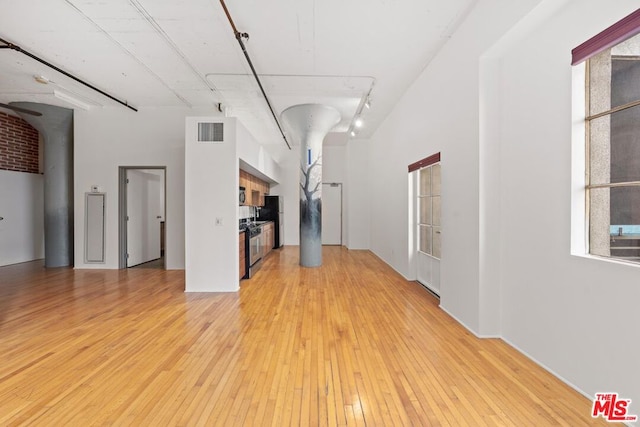 unfurnished living room with light wood-type flooring