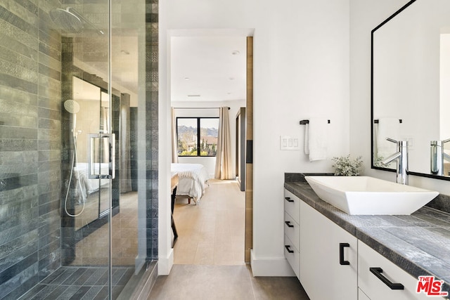 bathroom with vanity and an enclosed shower