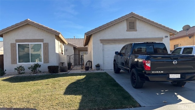 view of front of house with a garage and a front lawn