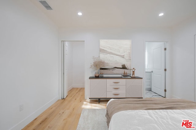 unfurnished bedroom featuring light wood-type flooring