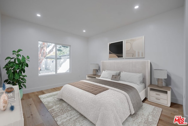 bedroom with light hardwood / wood-style floors