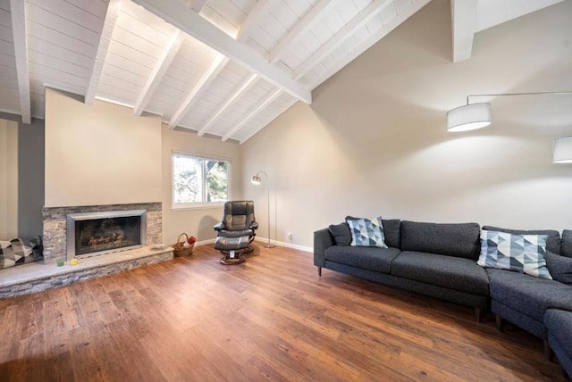 living room with beam ceiling, high vaulted ceiling, hardwood / wood-style floors, and a fireplace