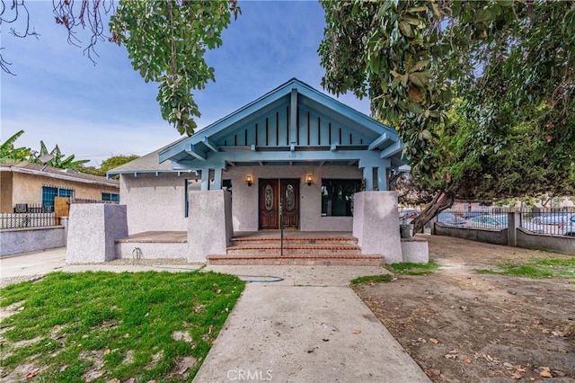 bungalow-style home featuring covered porch