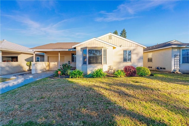 single story home with a front yard