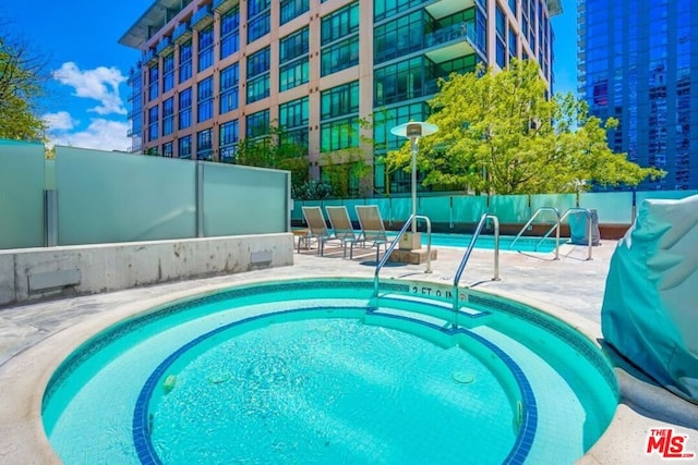 view of swimming pool with a patio