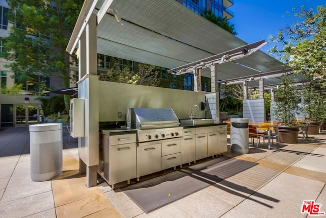 view of patio / terrace featuring area for grilling, grilling area, and sink