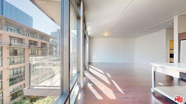 hall with dark hardwood / wood-style flooring