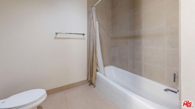 bathroom featuring tile patterned floors, shower / bath combo, and toilet