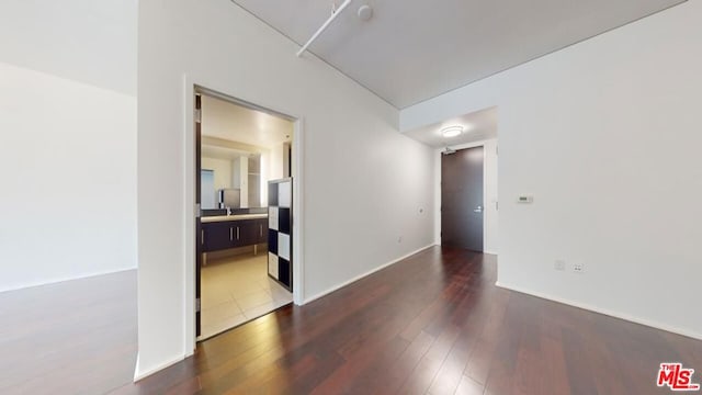 unfurnished room with hardwood / wood-style floors