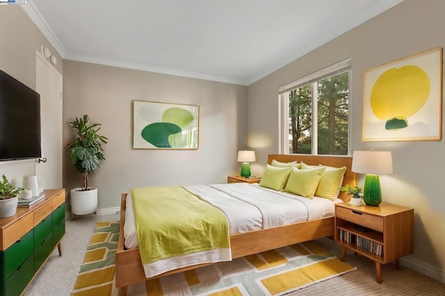 bedroom with carpet flooring and ornamental molding