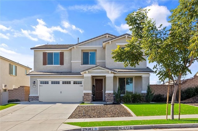 craftsman-style home featuring a garage and a front lawn