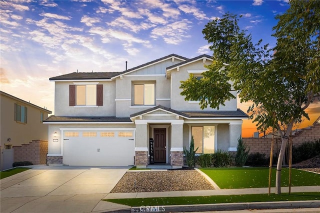 view of front facade featuring a lawn and a garage