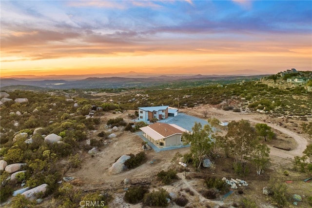 aerial view at dusk with a mountain view