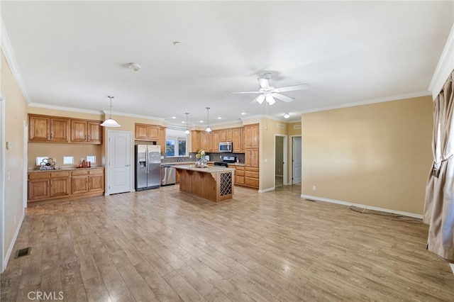 kitchen with light hardwood / wood-style flooring, pendant lighting, a kitchen island, stainless steel appliances, and ornamental molding