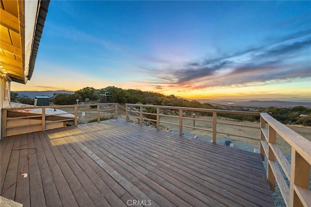 deck at dusk with a mountain view