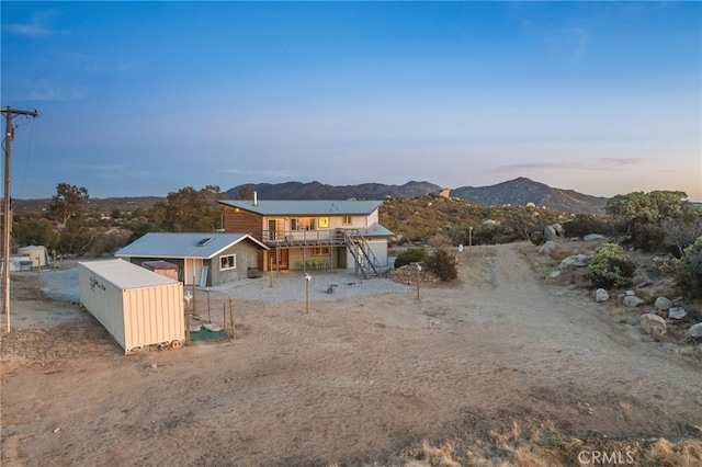 exterior space featuring a deck with mountain view