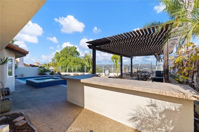 view of patio / terrace with a pergola and an in ground hot tub