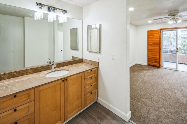 bathroom featuring ceiling fan and vanity