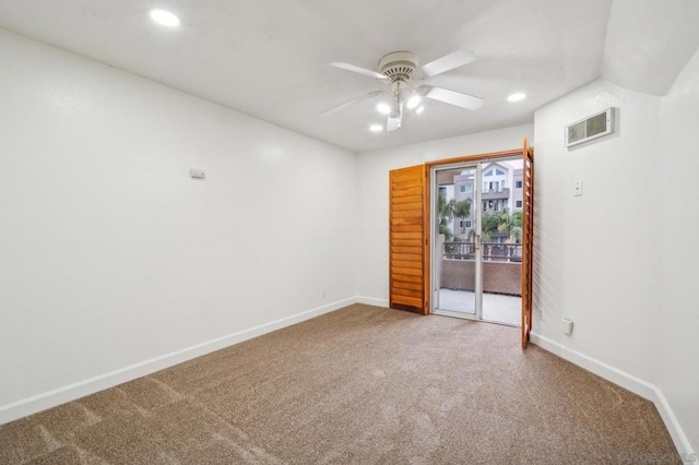 spare room with carpet and ceiling fan