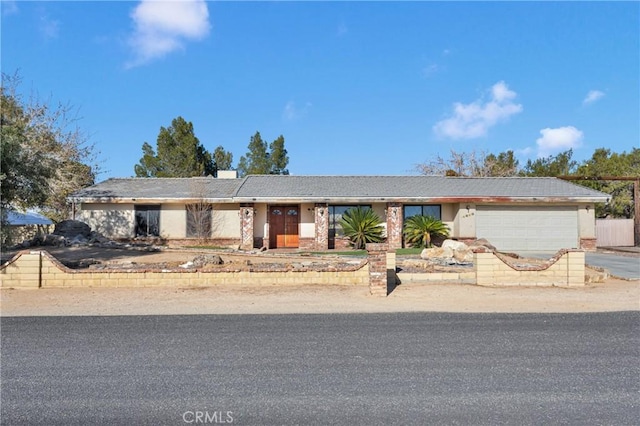 single story home with a garage