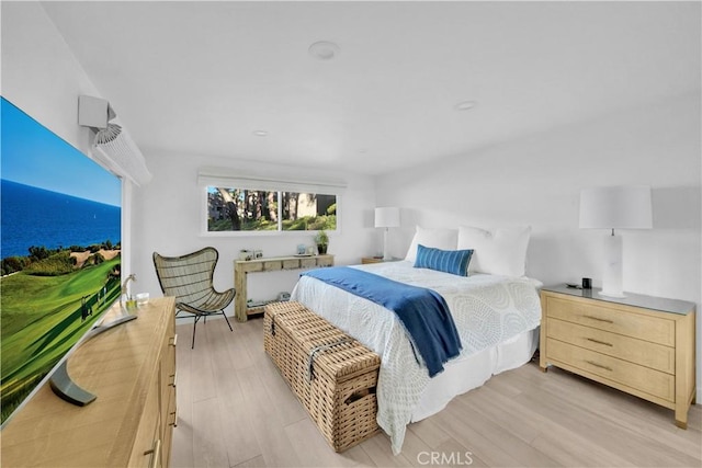 bedroom with light hardwood / wood-style flooring