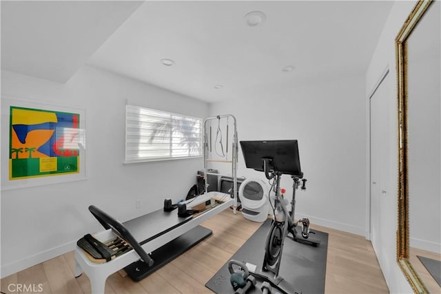 workout room with light wood-type flooring